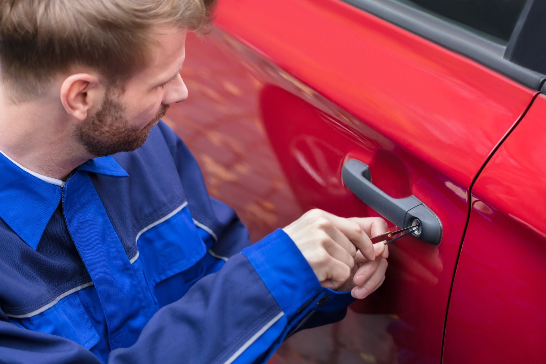 Locksmith working to unlock your car door.